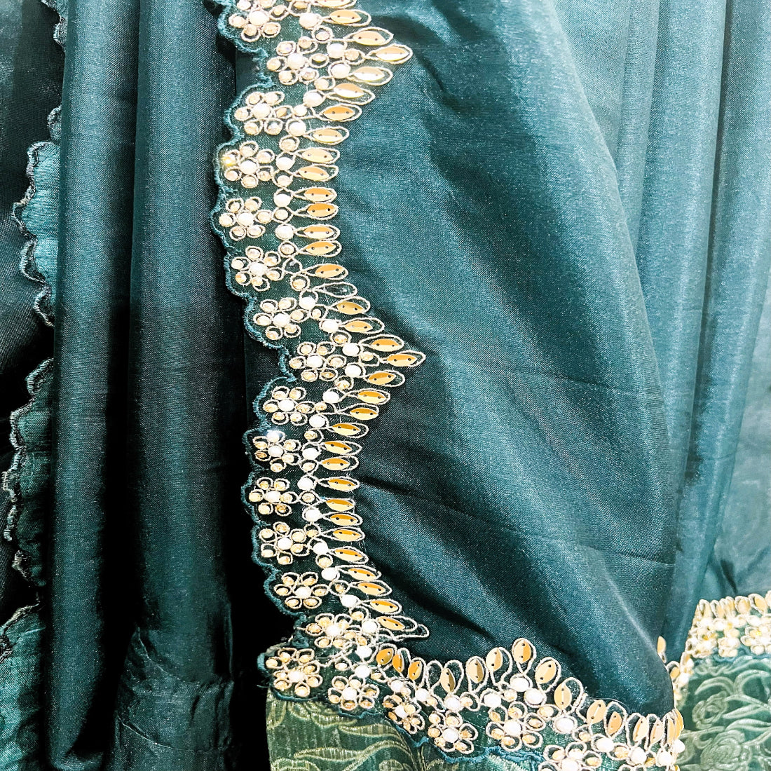 Forest Green Silk Saree with intricate cutwork Lace.
