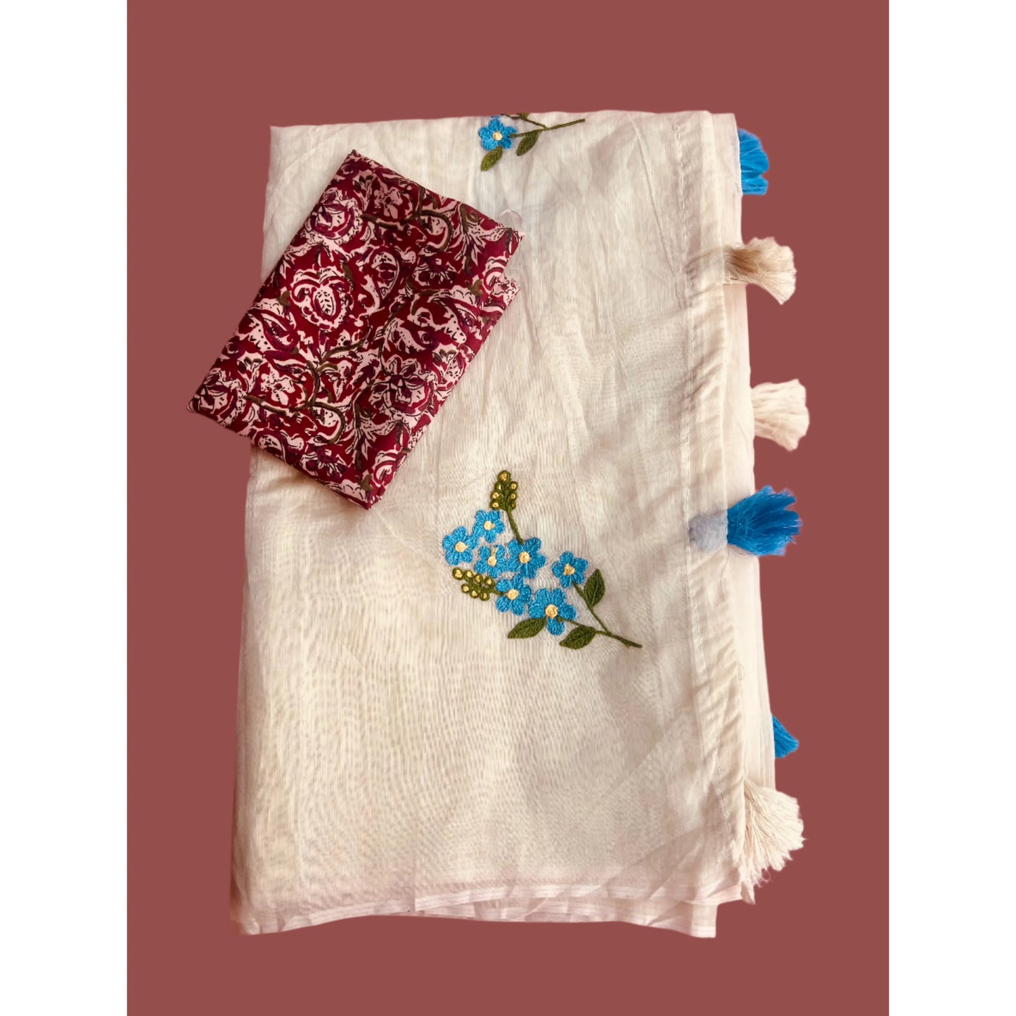 Beige Saree in Tussar blend and Ajrakh print blouse.