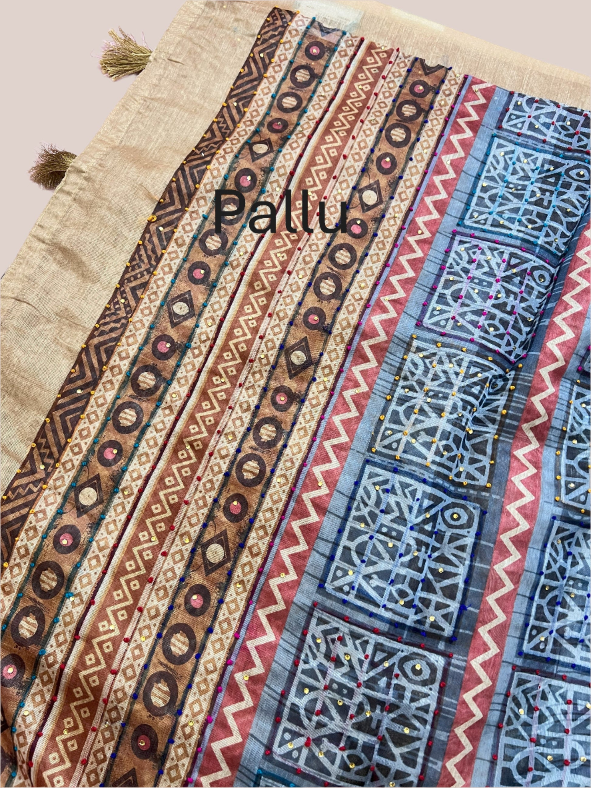 Colorful fabric pallu with geometric patterns on a light background